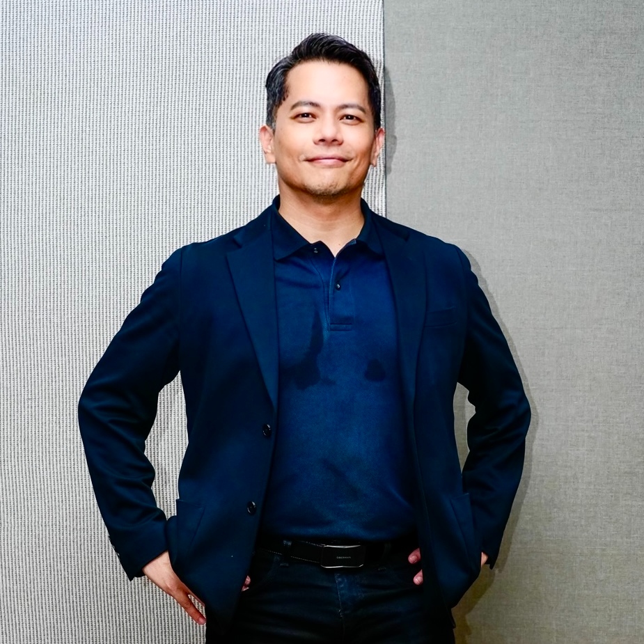 Brendan Wong speaking on stage